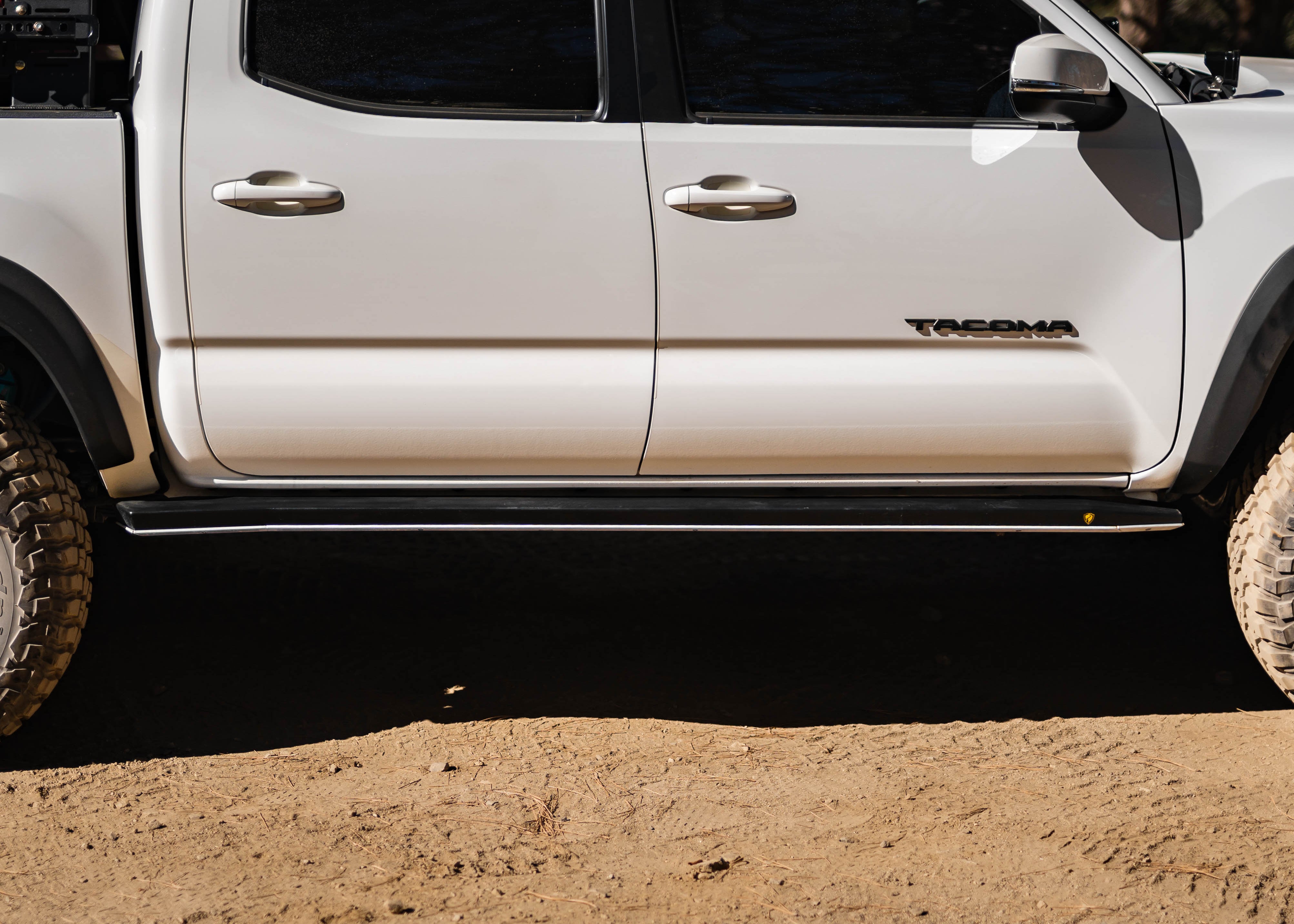 Toyota Tacoma rock sliders with replaceable aluminum skid plates