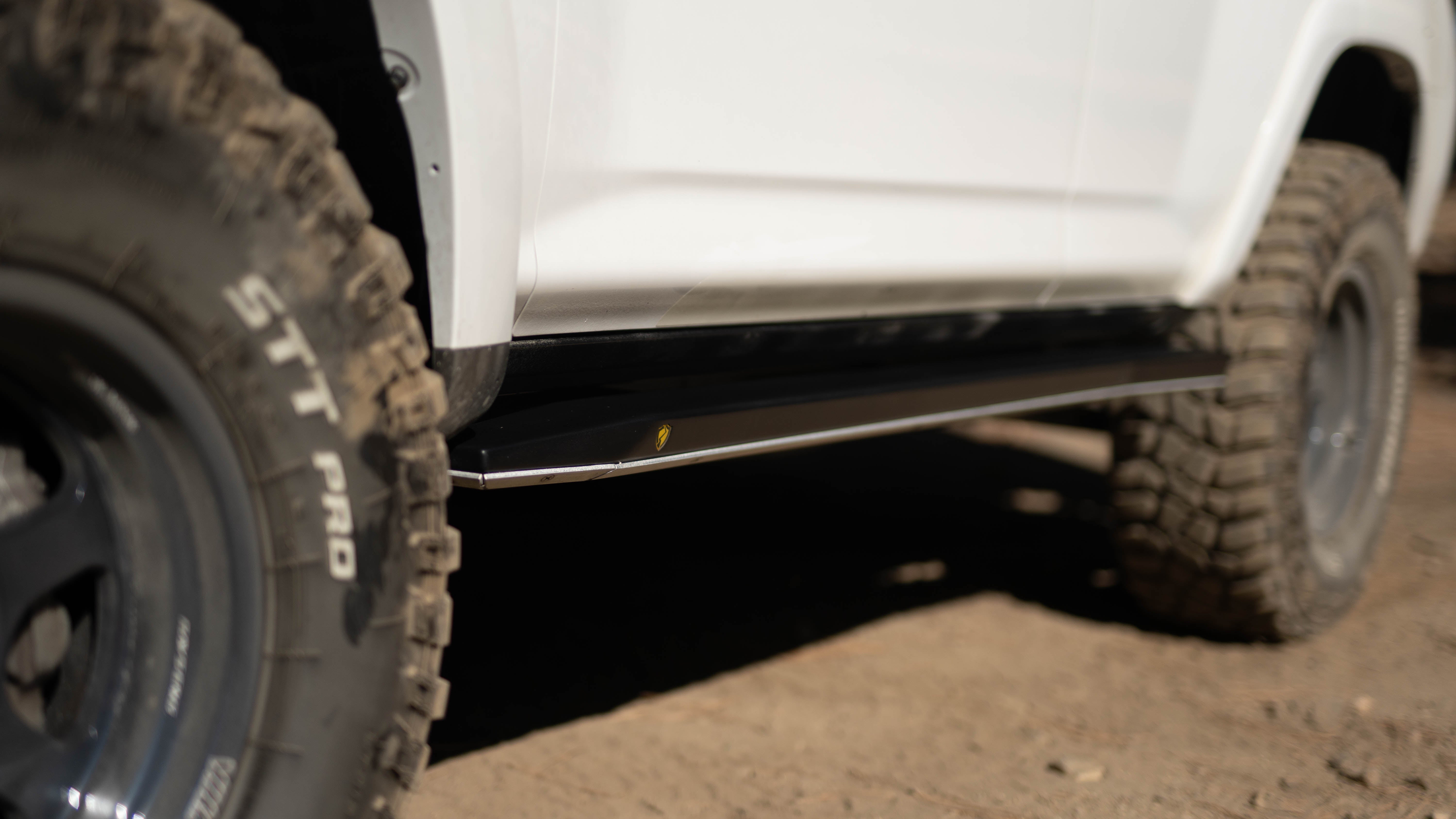 Close-up of Saints Offroad 4Runner rock slider with aluminum skid plate