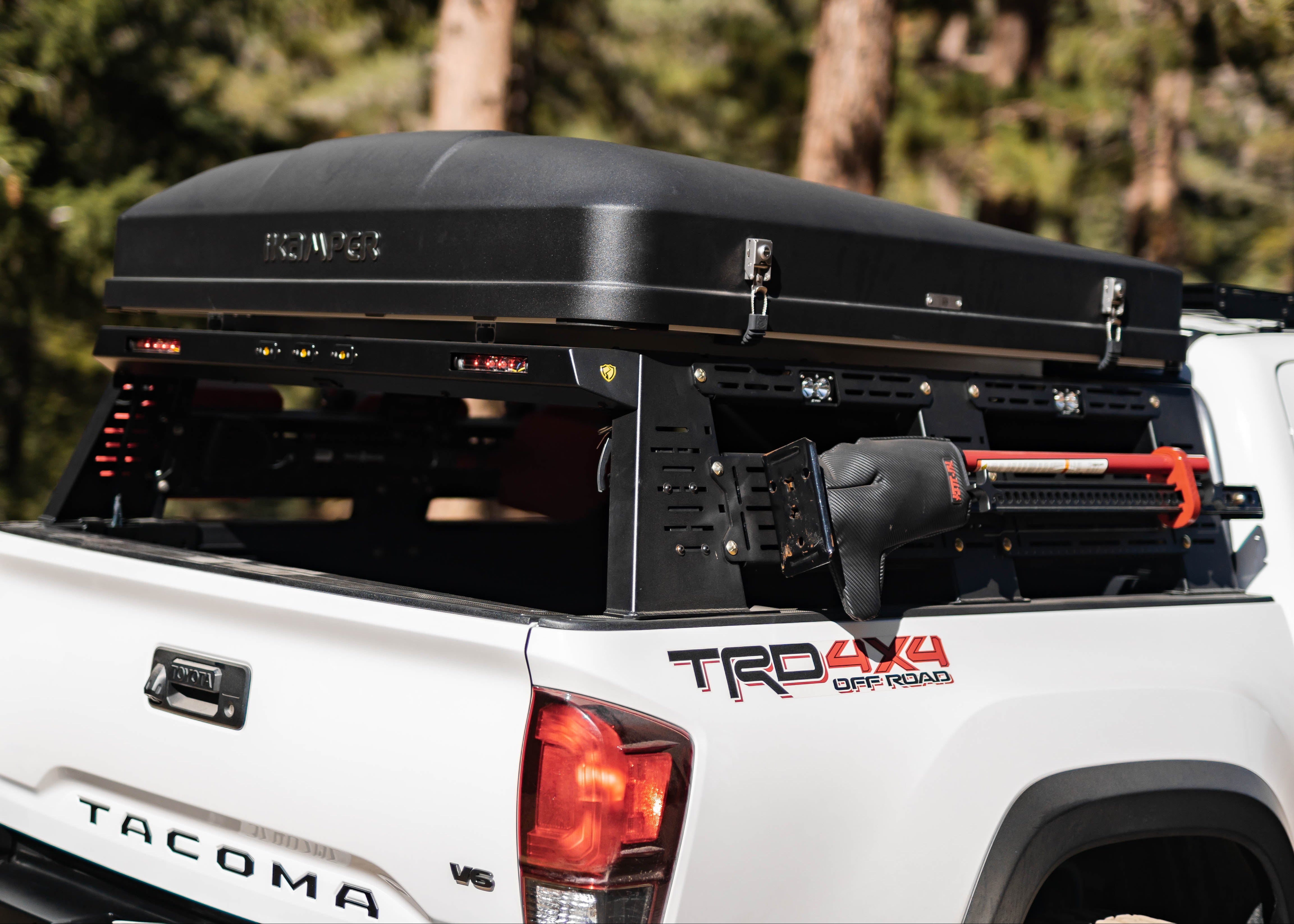 2016–2023 Toyota Tacoma with Saints Offroad bed rack installed, rear three-quarter view