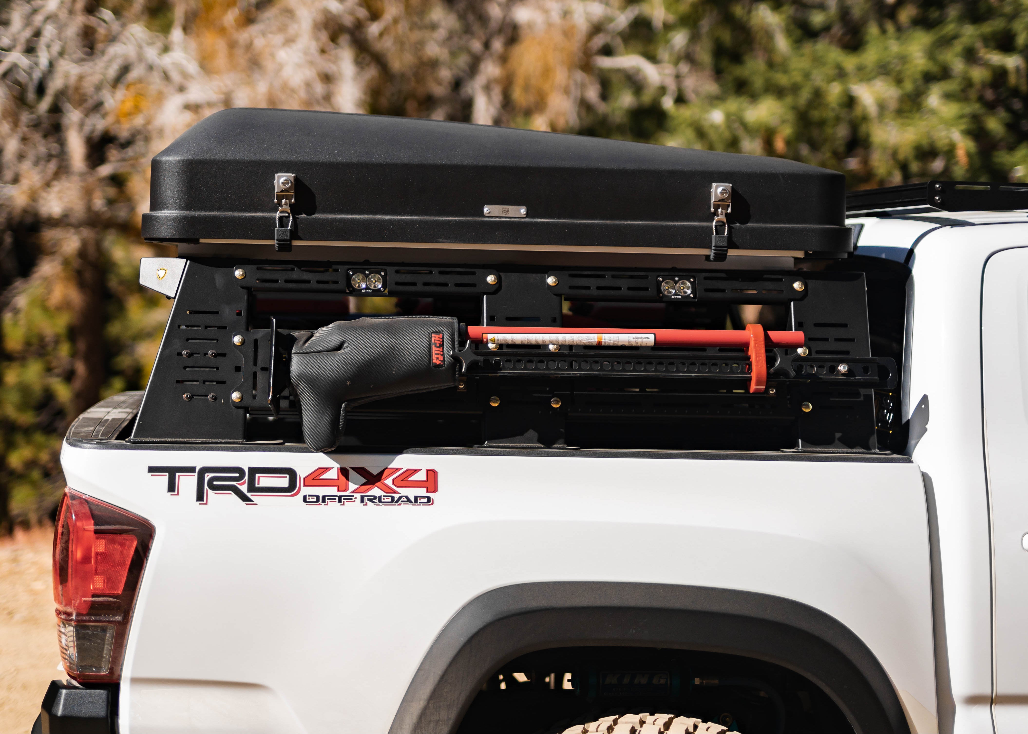 Toyota Tacoma bed rack with rooftop tent and rear chase light housing