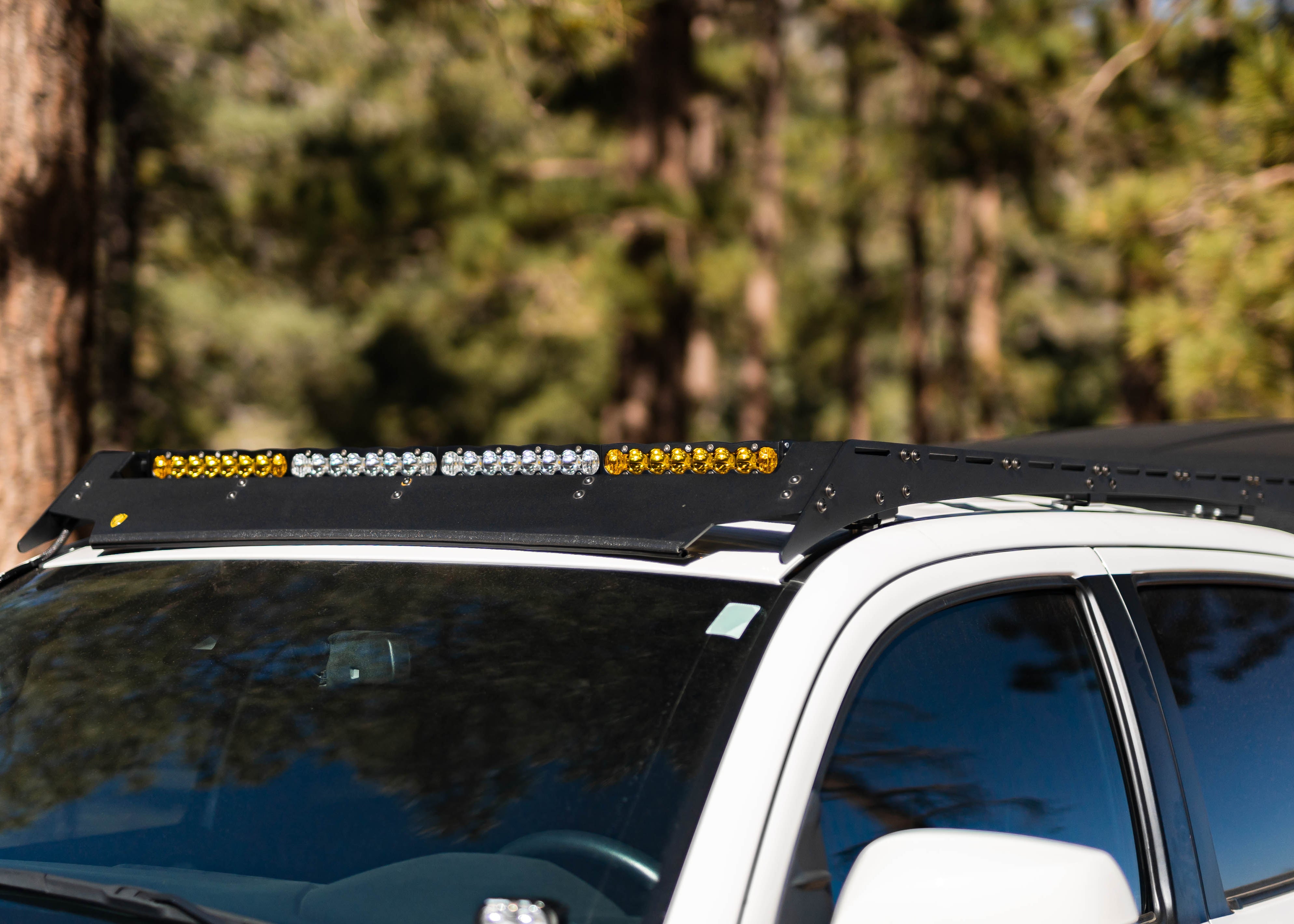2016–2023 Toyota Tacoma with Saints Offroad roof rack installed, front three-quarter view