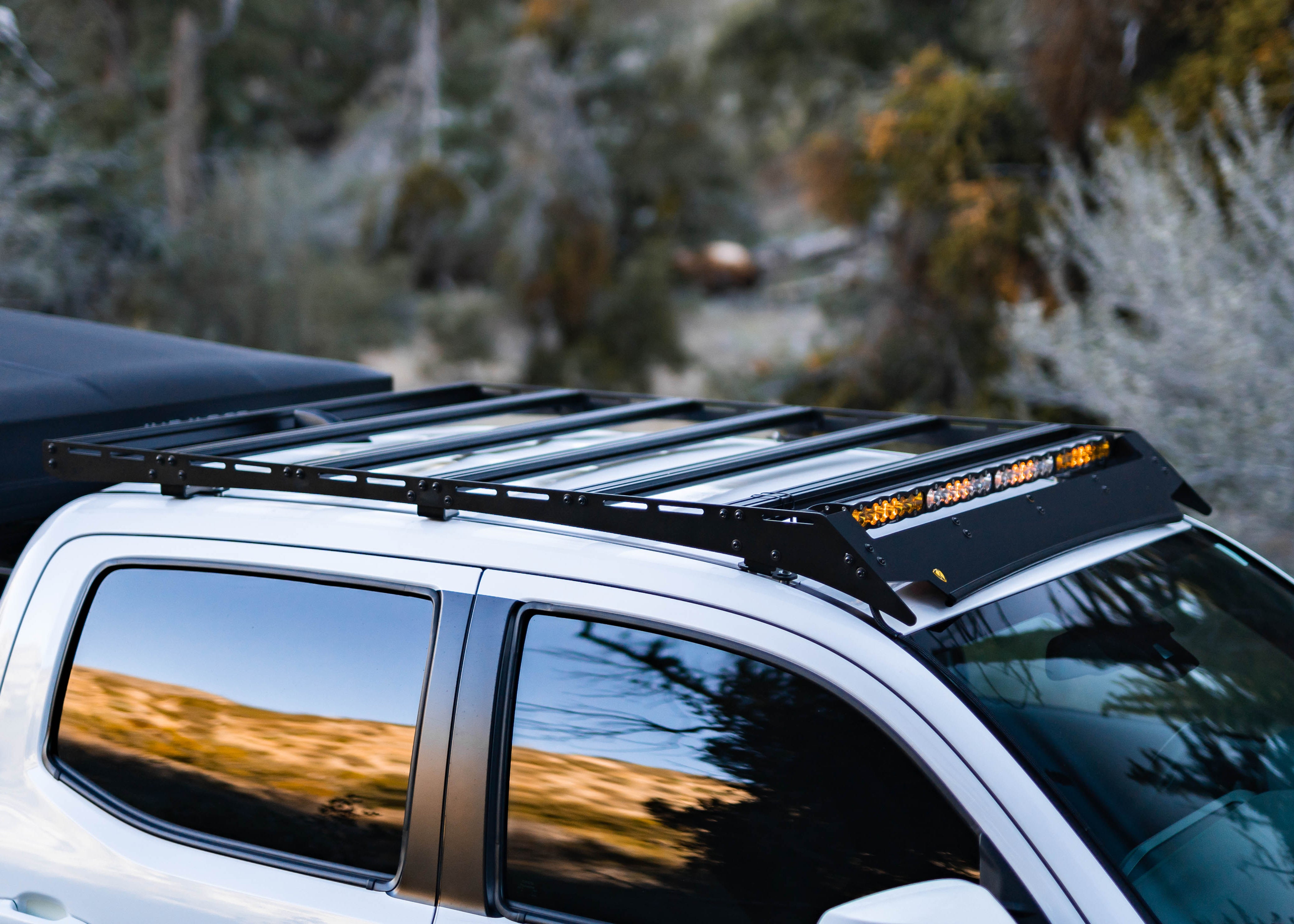 Toyota Tacoma roof rack with gear mounted to the Saints Offroad rack system