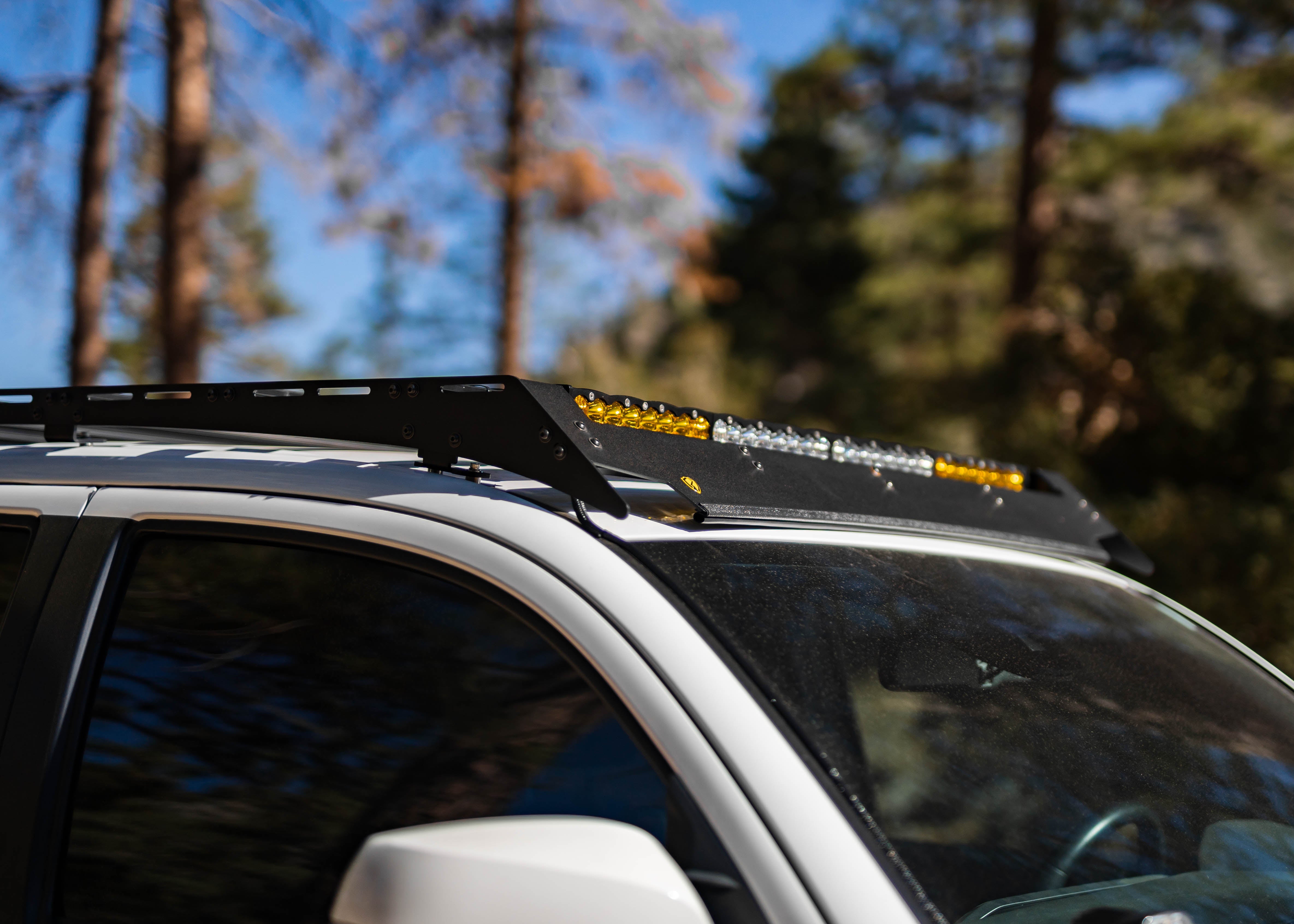 Side view of Saints Offroad Toyota Tacoma roof rack and aluminum crossbars