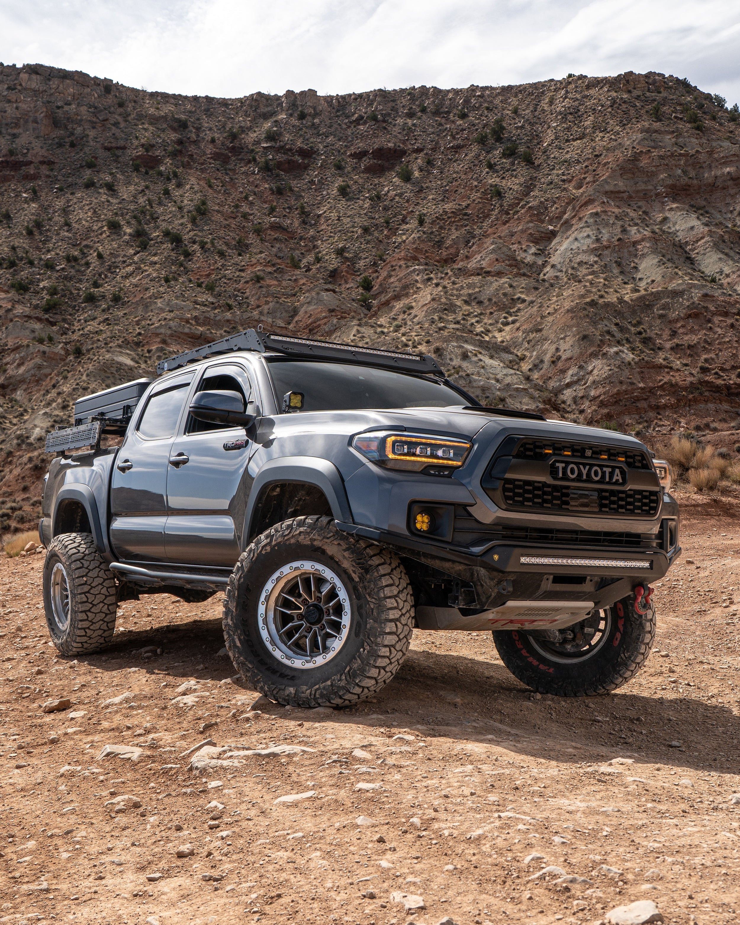 Toyota Tacoma Alpha Front Bumper on rocky off-road terrain